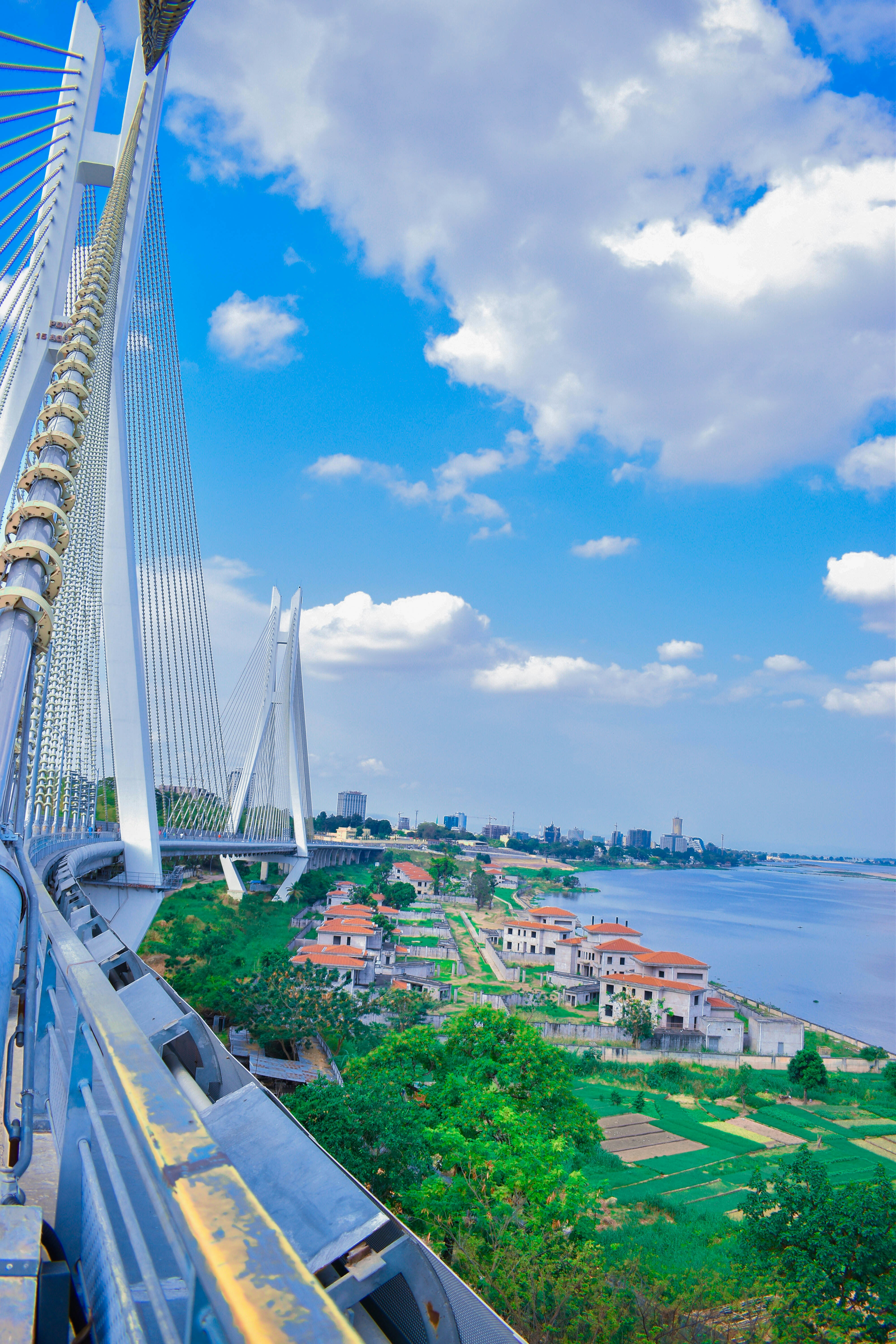 Massive modern bridge infrastructure spanning a wide river — precision engineering and large-scale construction