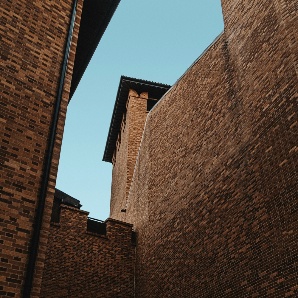 a tall brick building next to a tall brick building