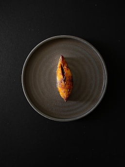 a piece of food on a plate on a table