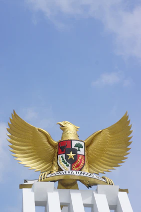 A powerful golden eagle emblem shining against a sleek black background symbolizing strength and security.