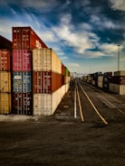 a bunch of cargo containers stacked on top of each other