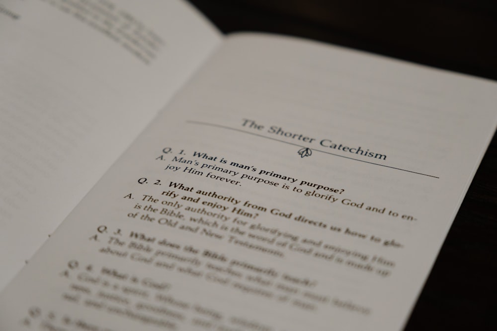 a close up of an open book on a table