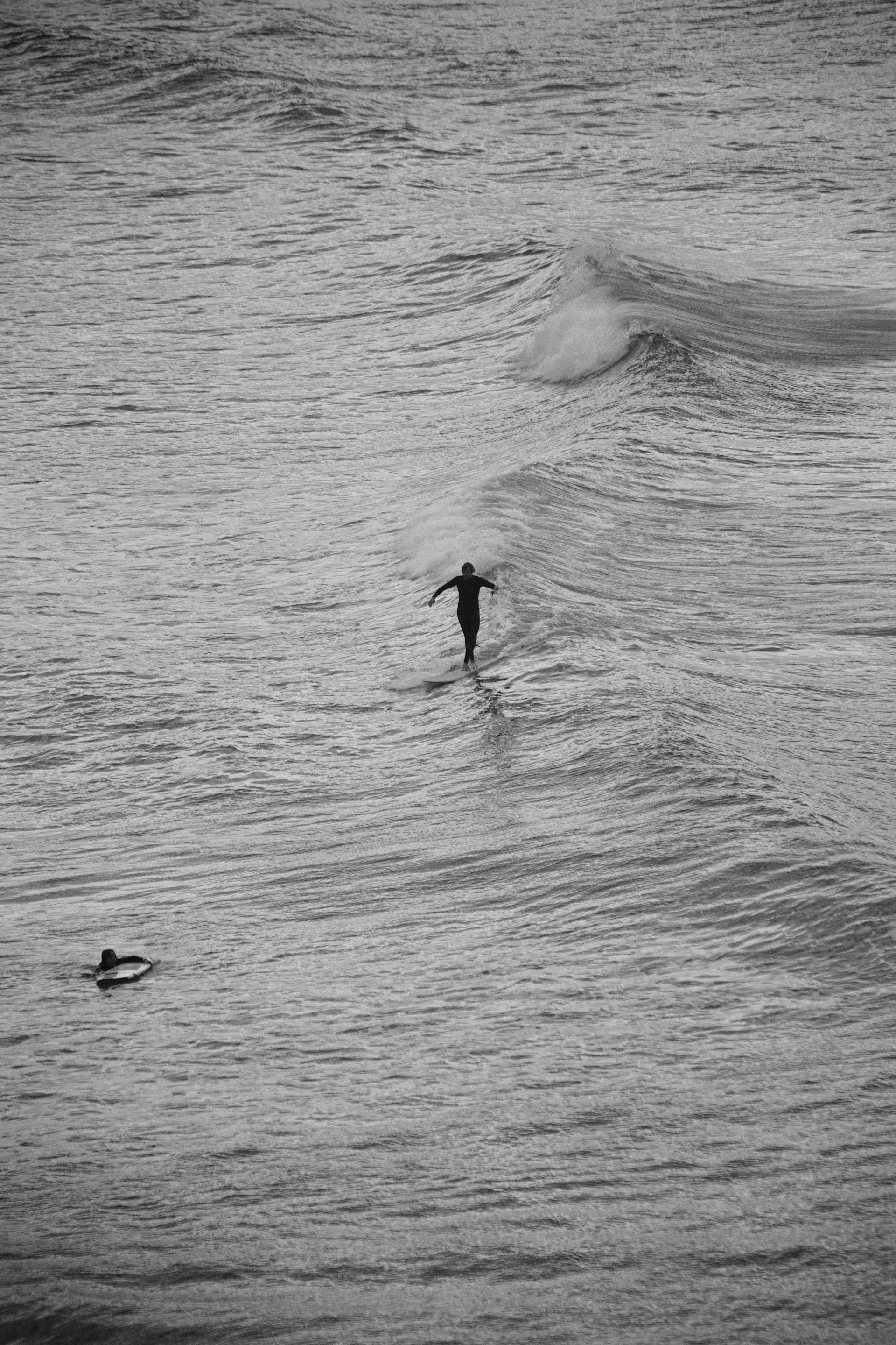 a person riding a wave on top of a surfboard