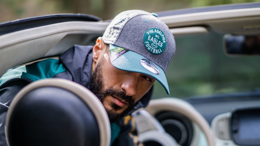 a man with a beard wearing a hat