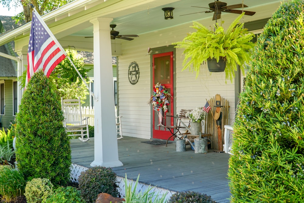 a porch with a flag on the front of it