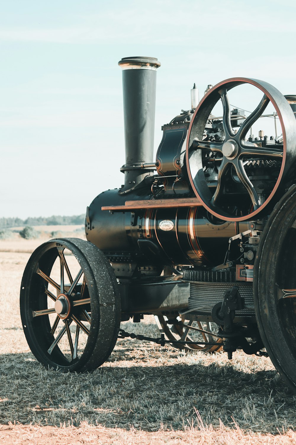 an old steam engine sitting in a field