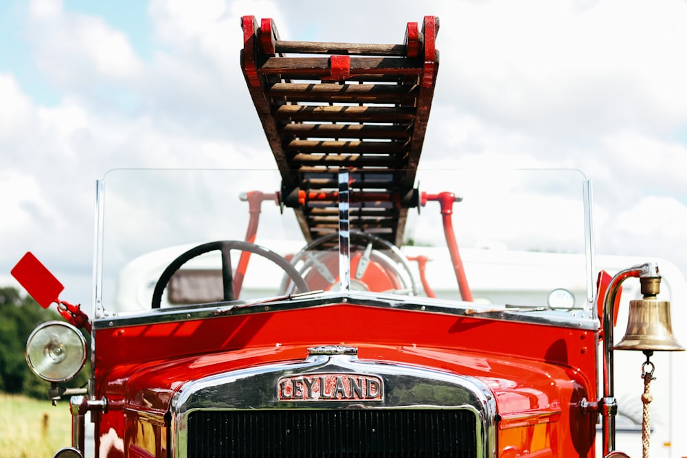 the front of a red truck with a bell on it