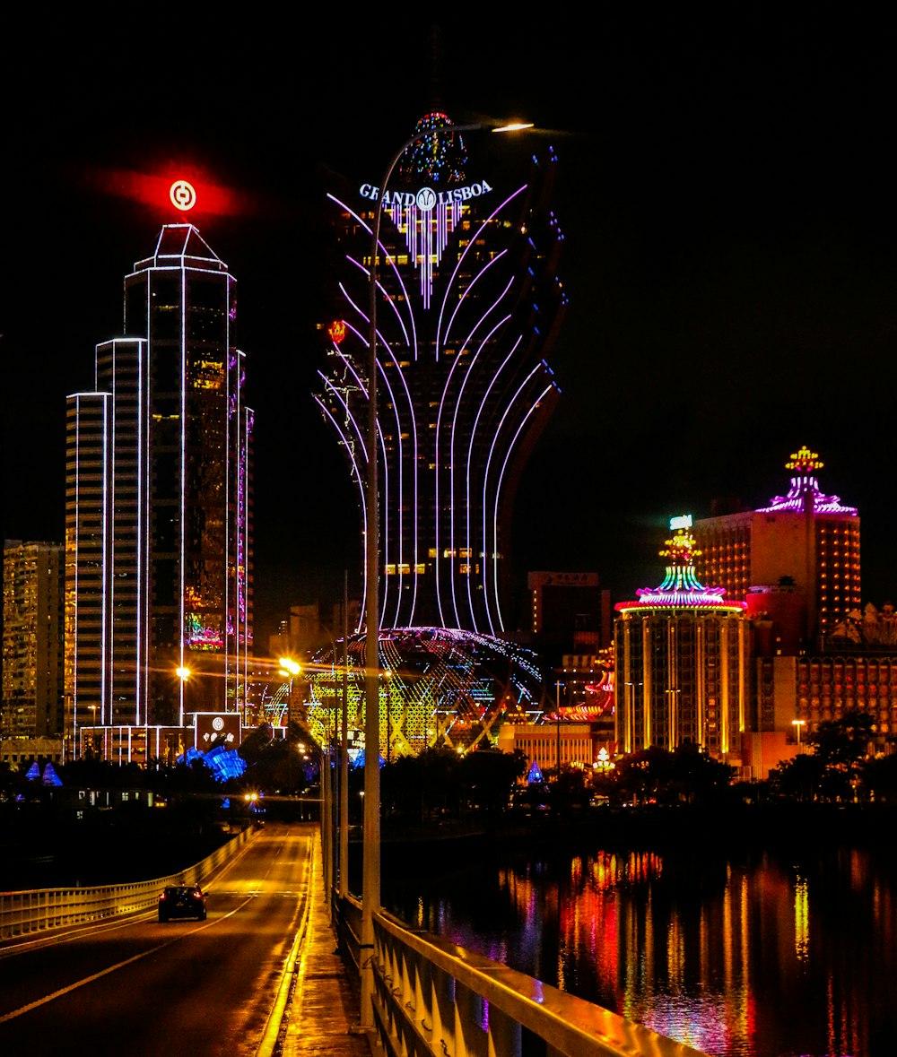 a view of a city at night from across the street