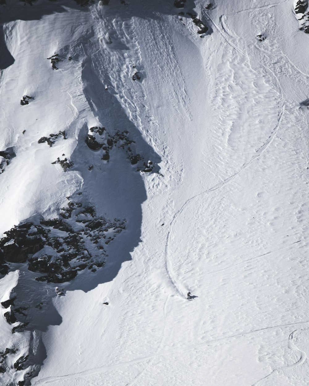 a person skiing down a snow covered mountain