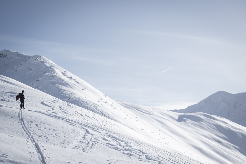 a person skiing down a snow covered mountain