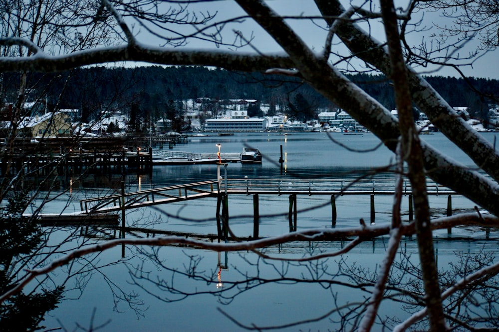 a boat is docked at a pier in the water