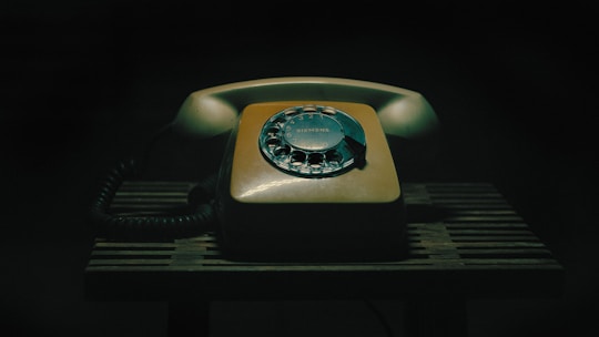 an old fashioned telephone sitting on a table