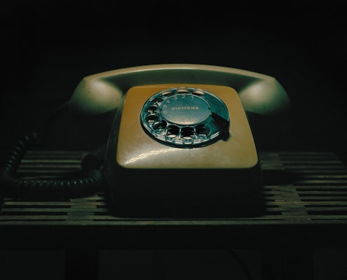 an old fashioned telephone sitting on a table