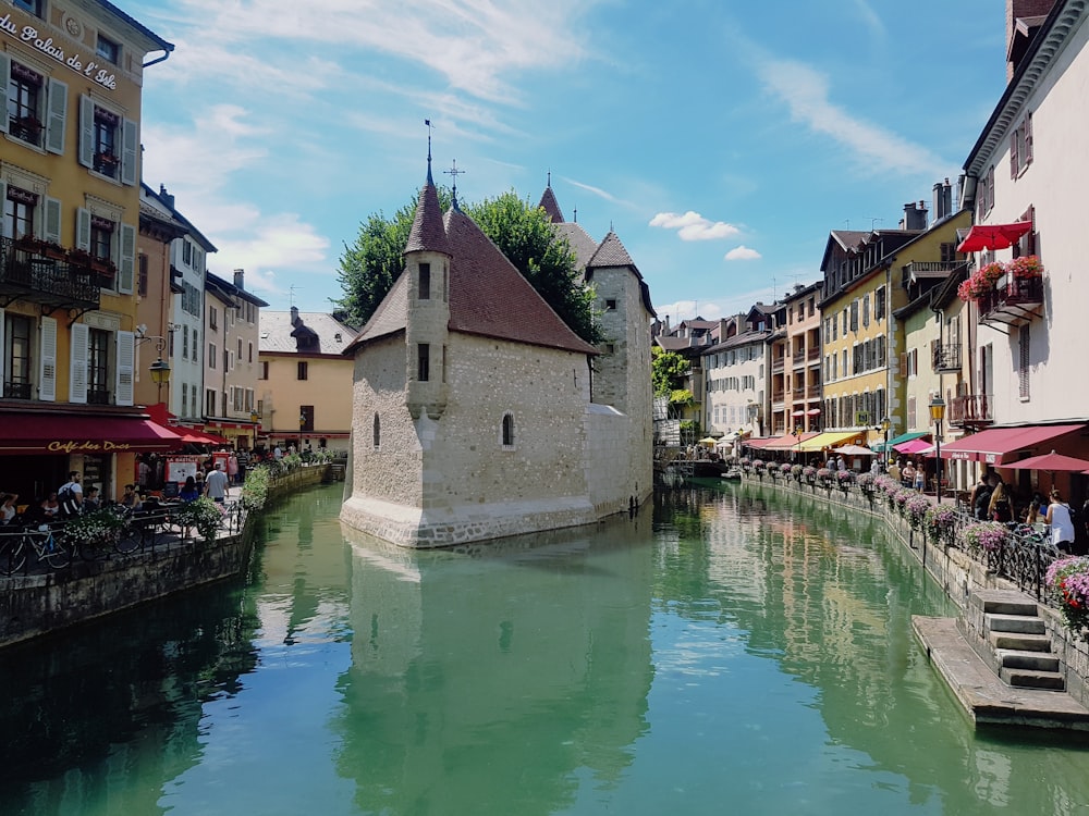 a river running through a city next to tall buildings