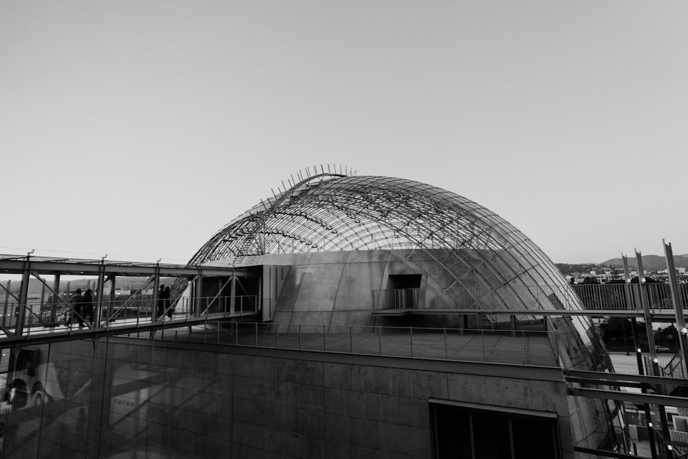 a black and white photo of a building under construction