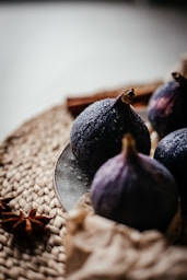some figs are on a plate on a table