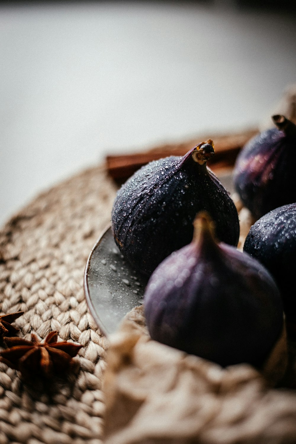some figs are on a plate on a table