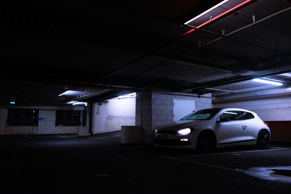 a white car parked in a parking garage