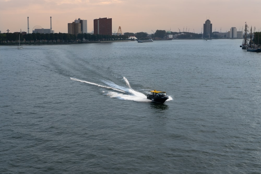 a speed boat speeding across a large body of water