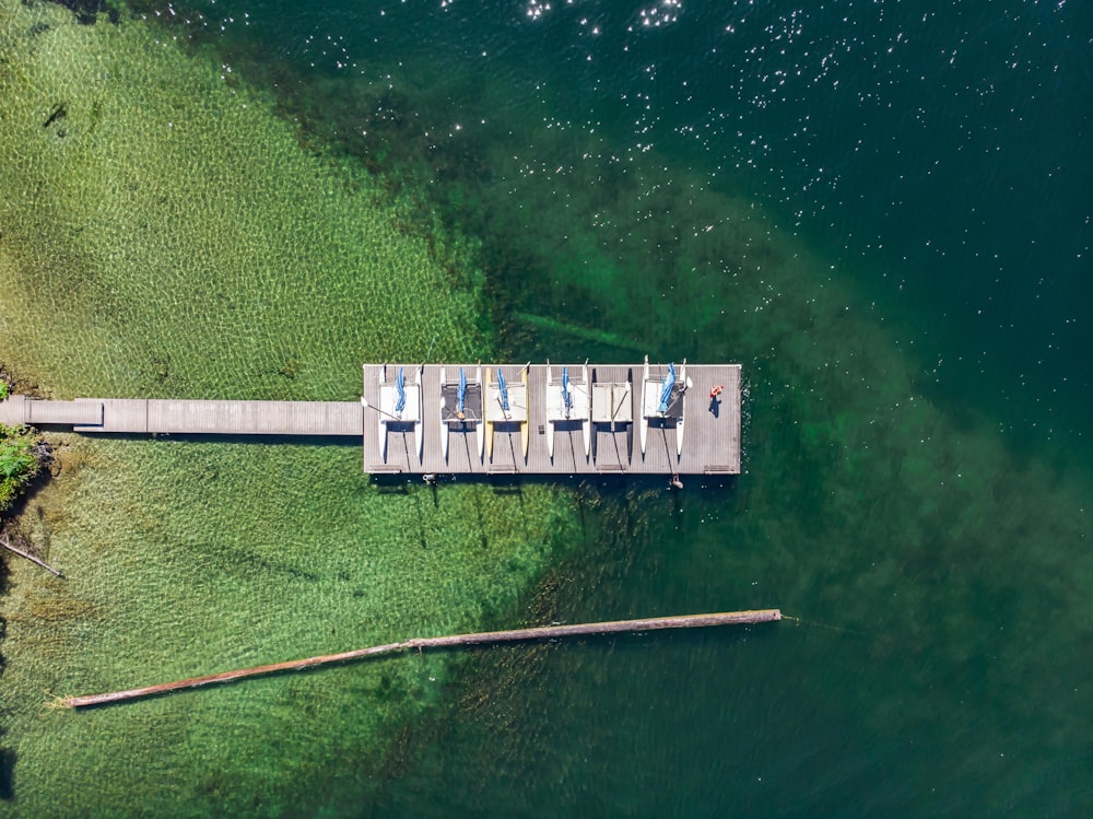 an aerial view of a dock and a body of water