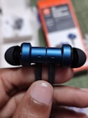 A close-up of a bluetooth headset showcasing its features.