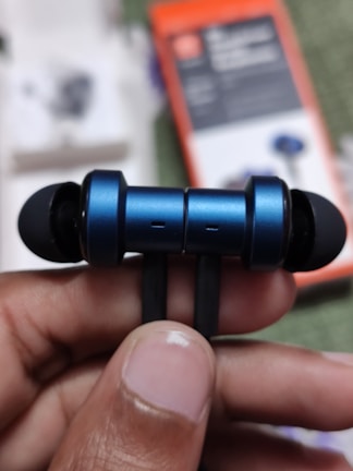A close-up of a bluetooth headset showcasing its features.