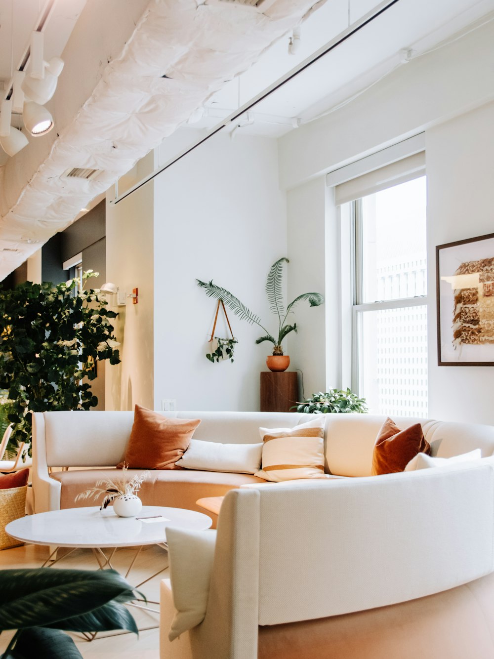 a living room filled with furniture and a large window