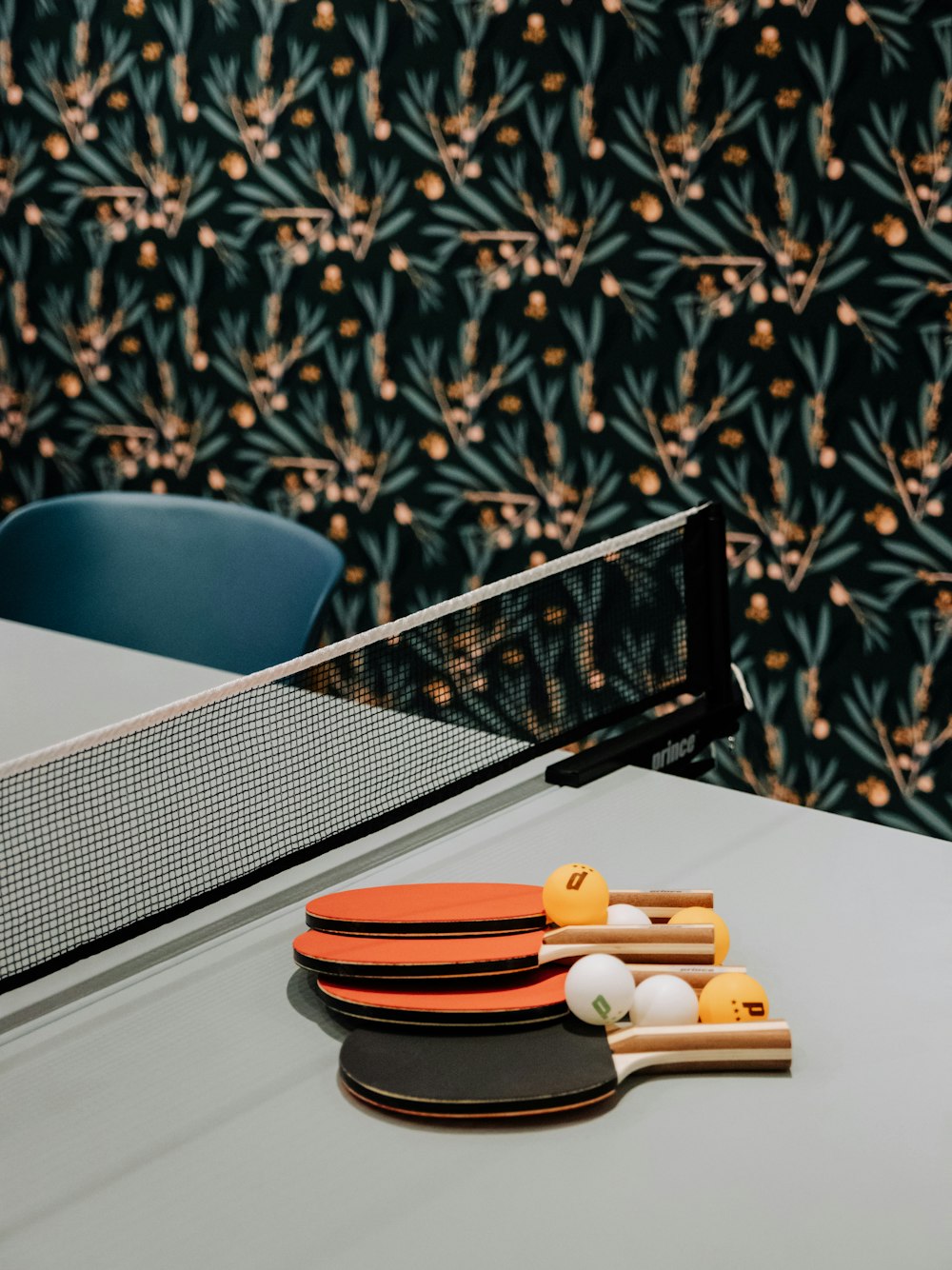 a ping pong table with ping pong paddles and ping pong balls