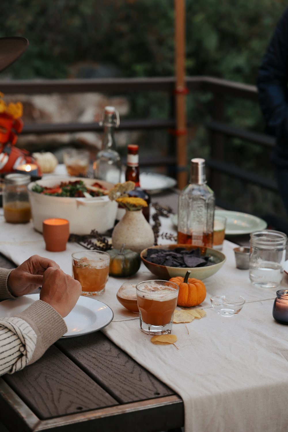 a person sitting at a table with a plate of food