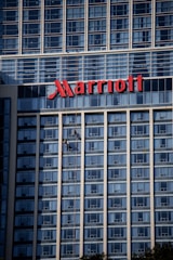 a tall building with a sign on top of it