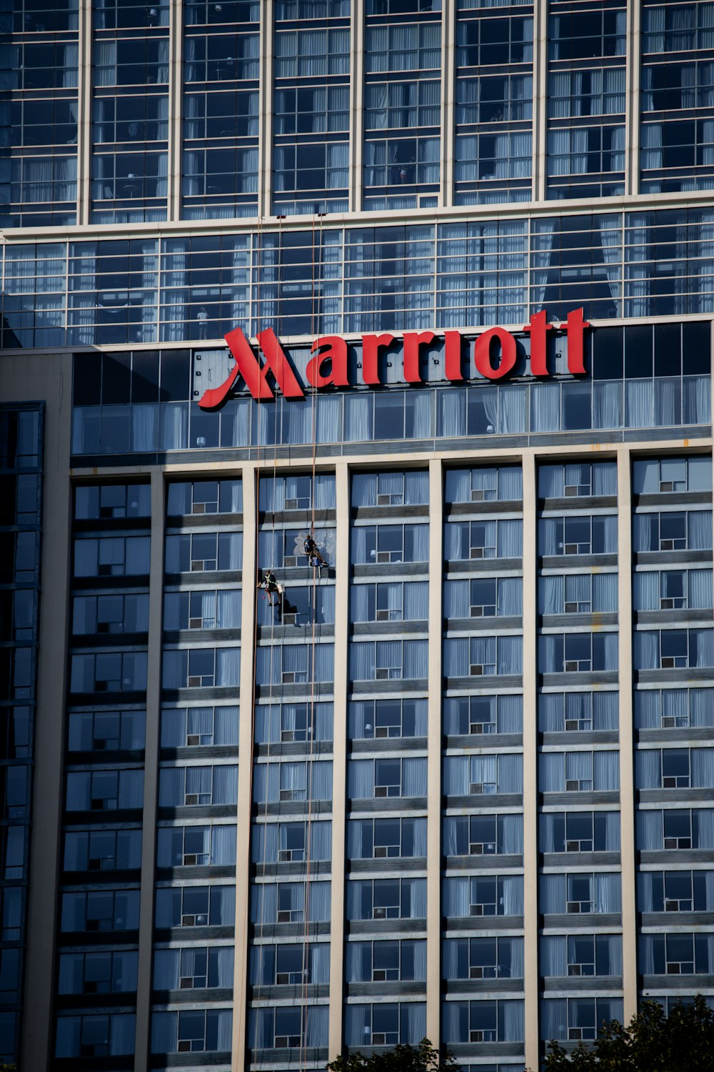 a tall building with a sign on top of it