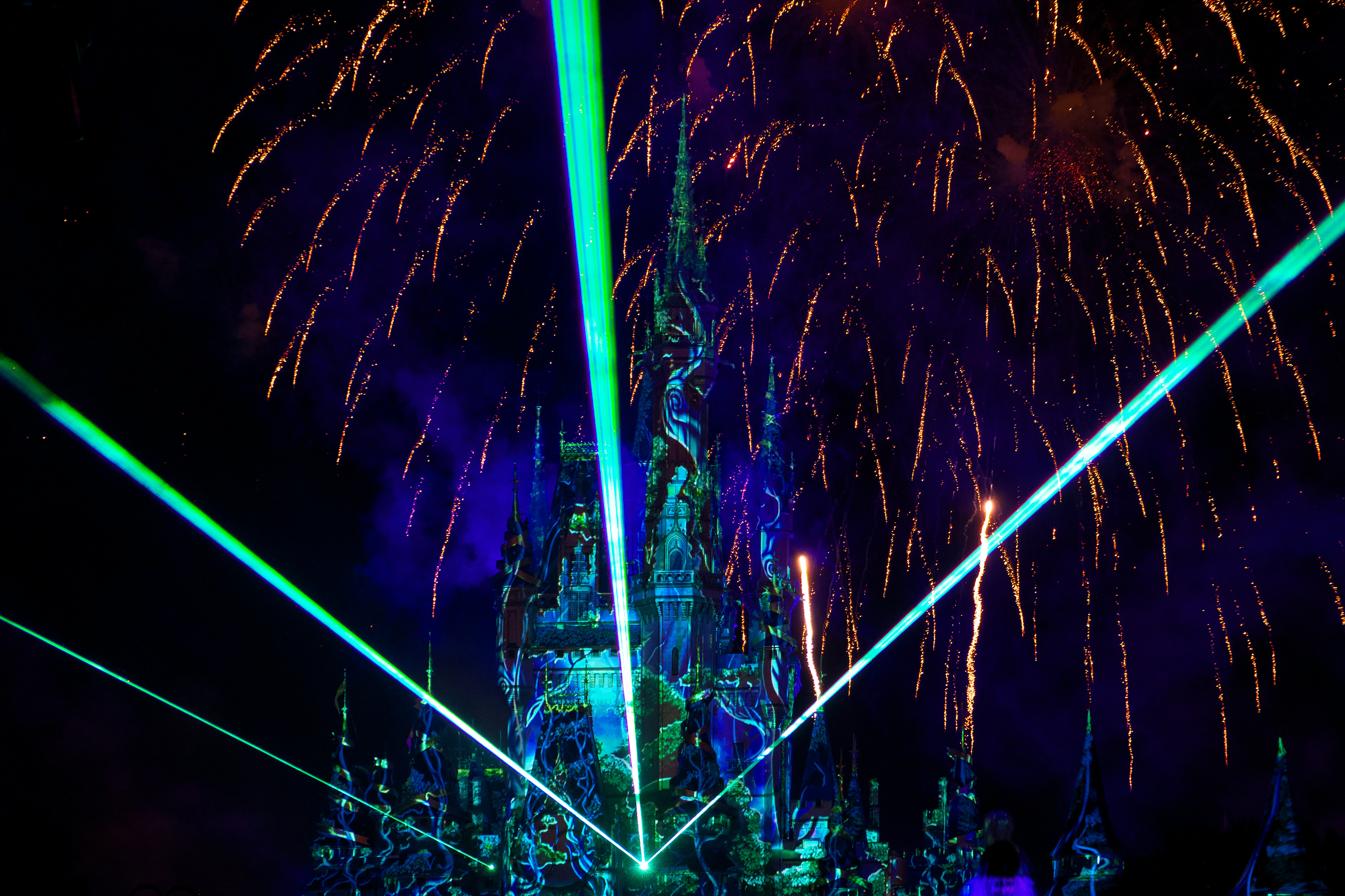 a fireworks display in front of a castle