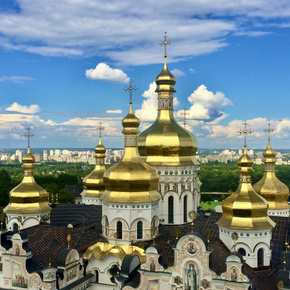 an aerial view of a church with golden domes