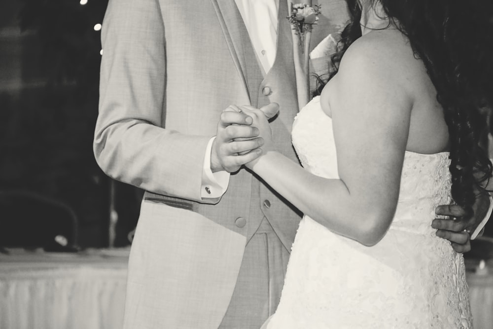 a man and a woman dance together at a wedding