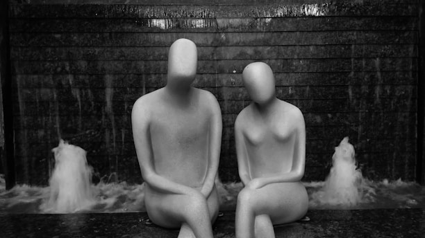 a couple of statues sitting next to each other