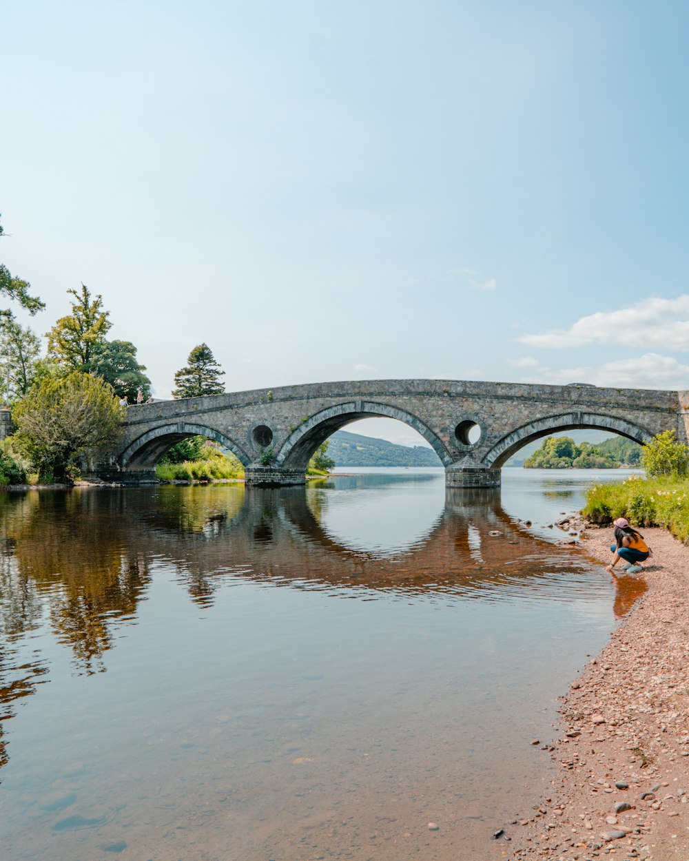 a stone bridge over a body of water