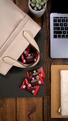Stylish leather laptop bag resting beside a modern workspace.