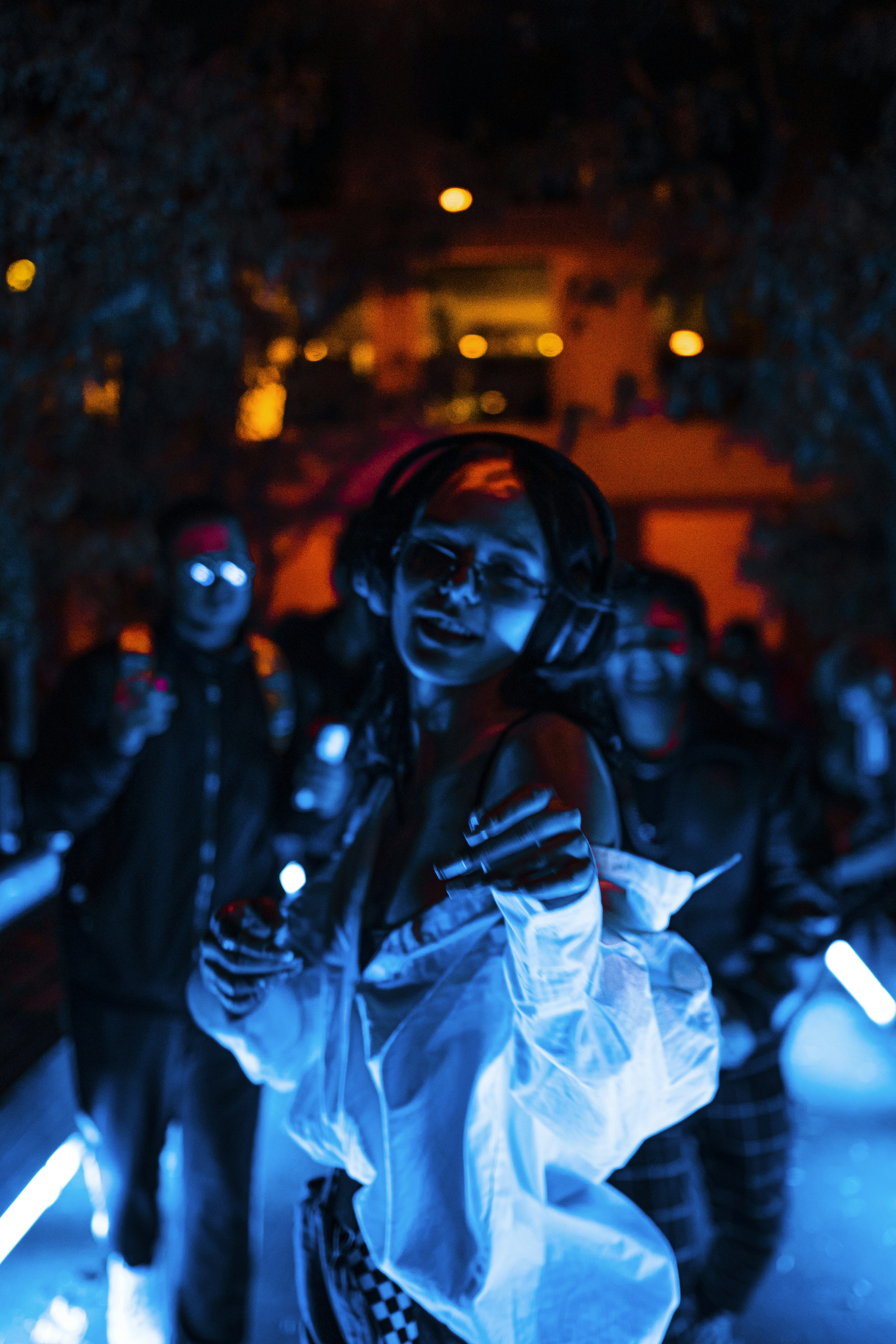 Foam party with glowing lights and attendees in costumes