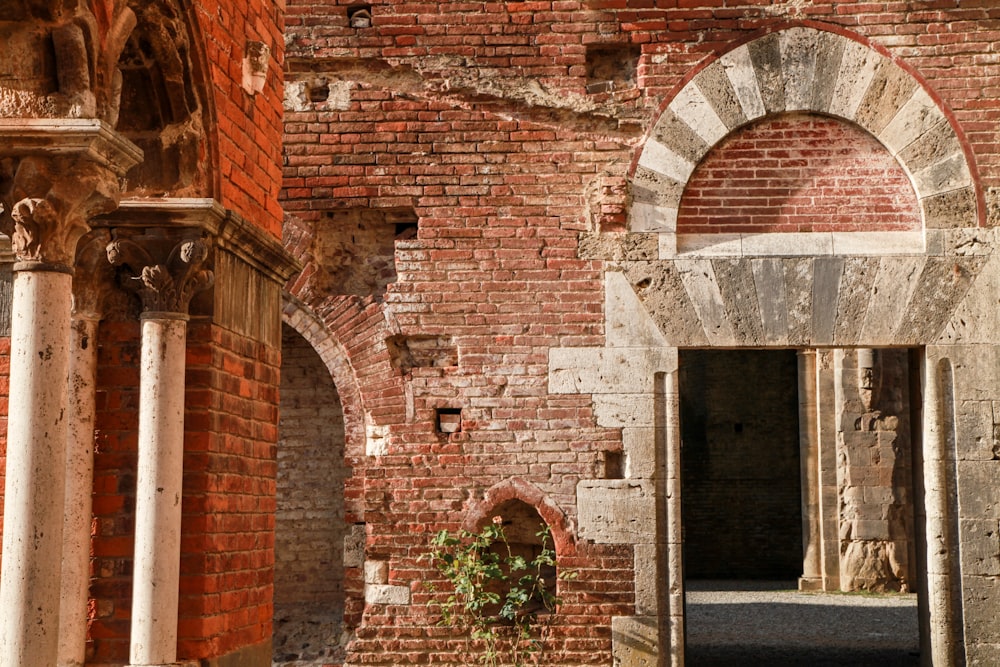 an old brick building with an arched doorway