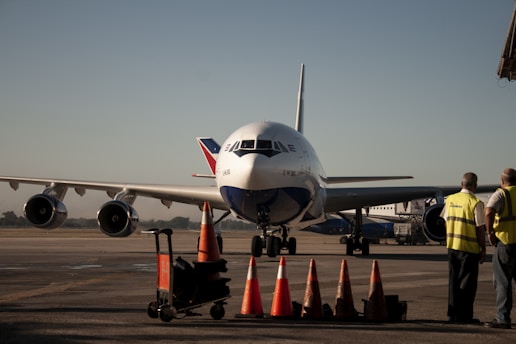 a large jetliner sitting on top of an airport tarmac