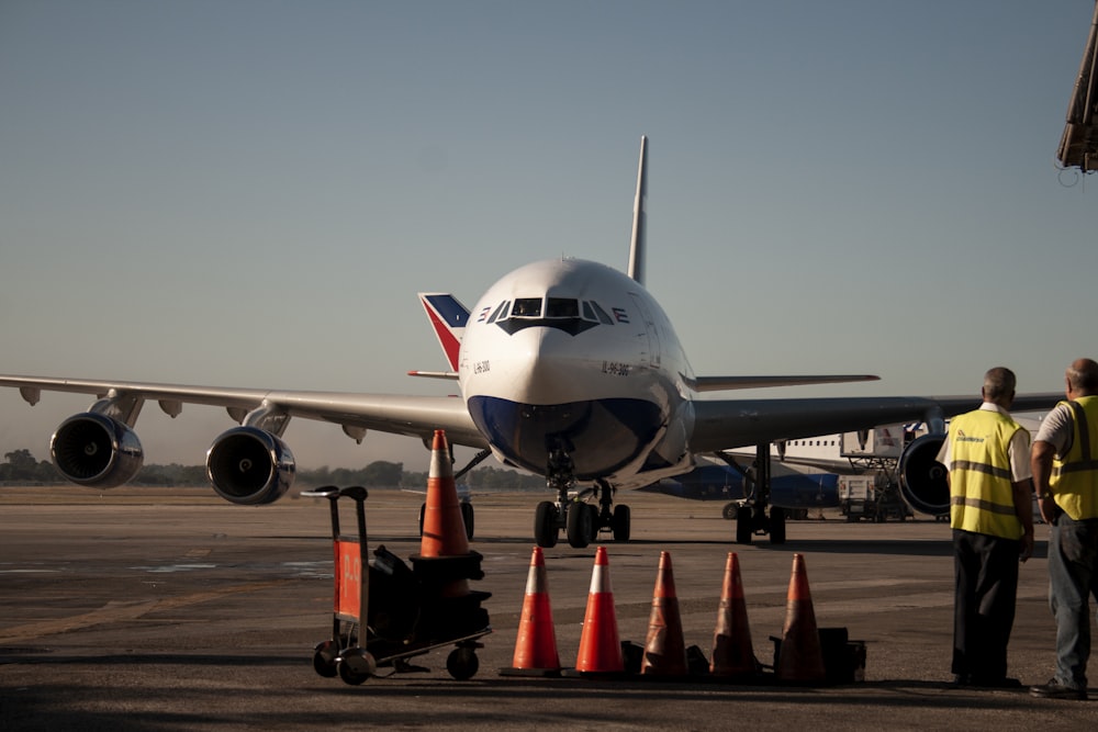 a large jetliner sitting on top of an airport tarmac