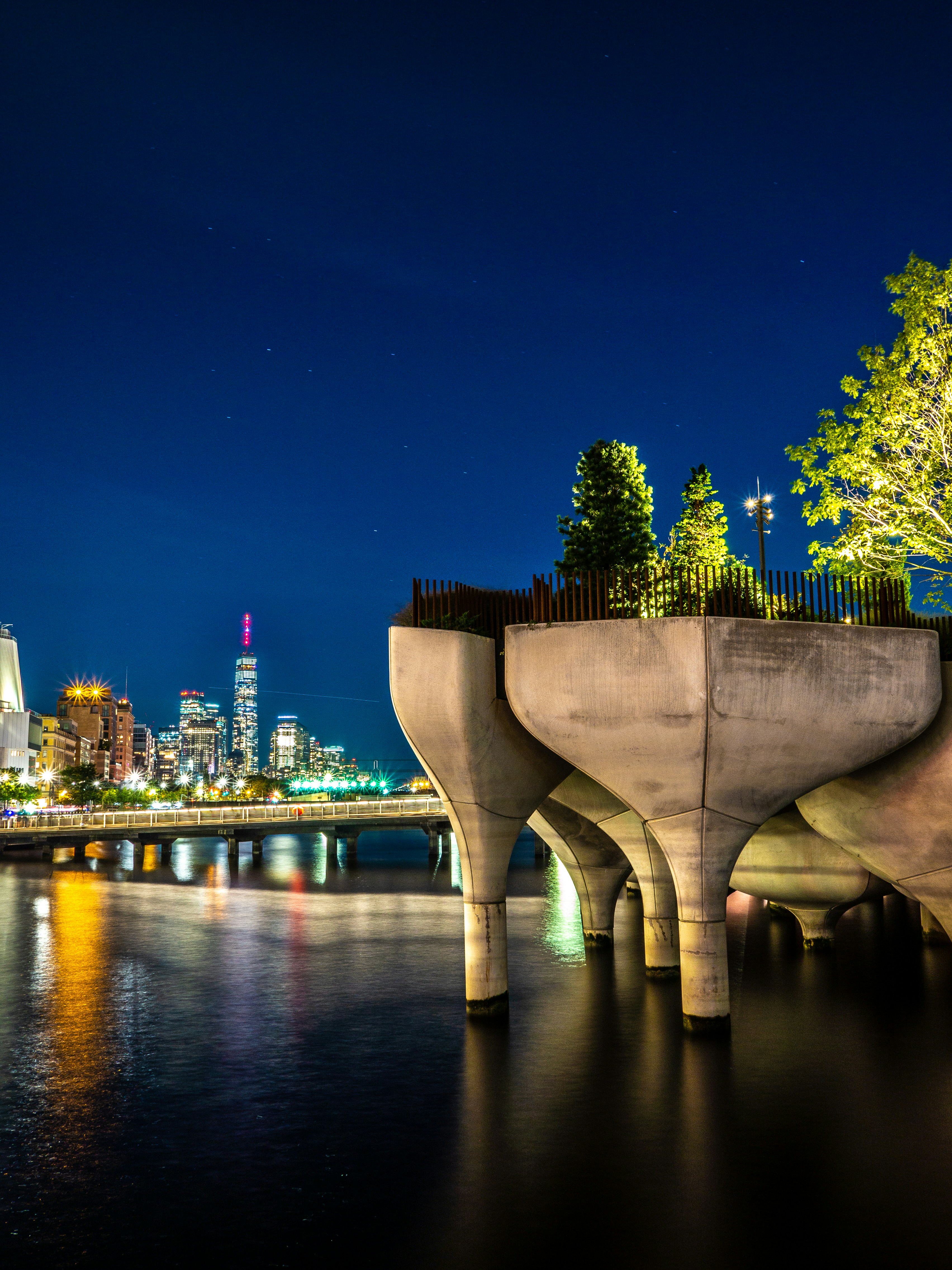 a night view of a city and a bridge