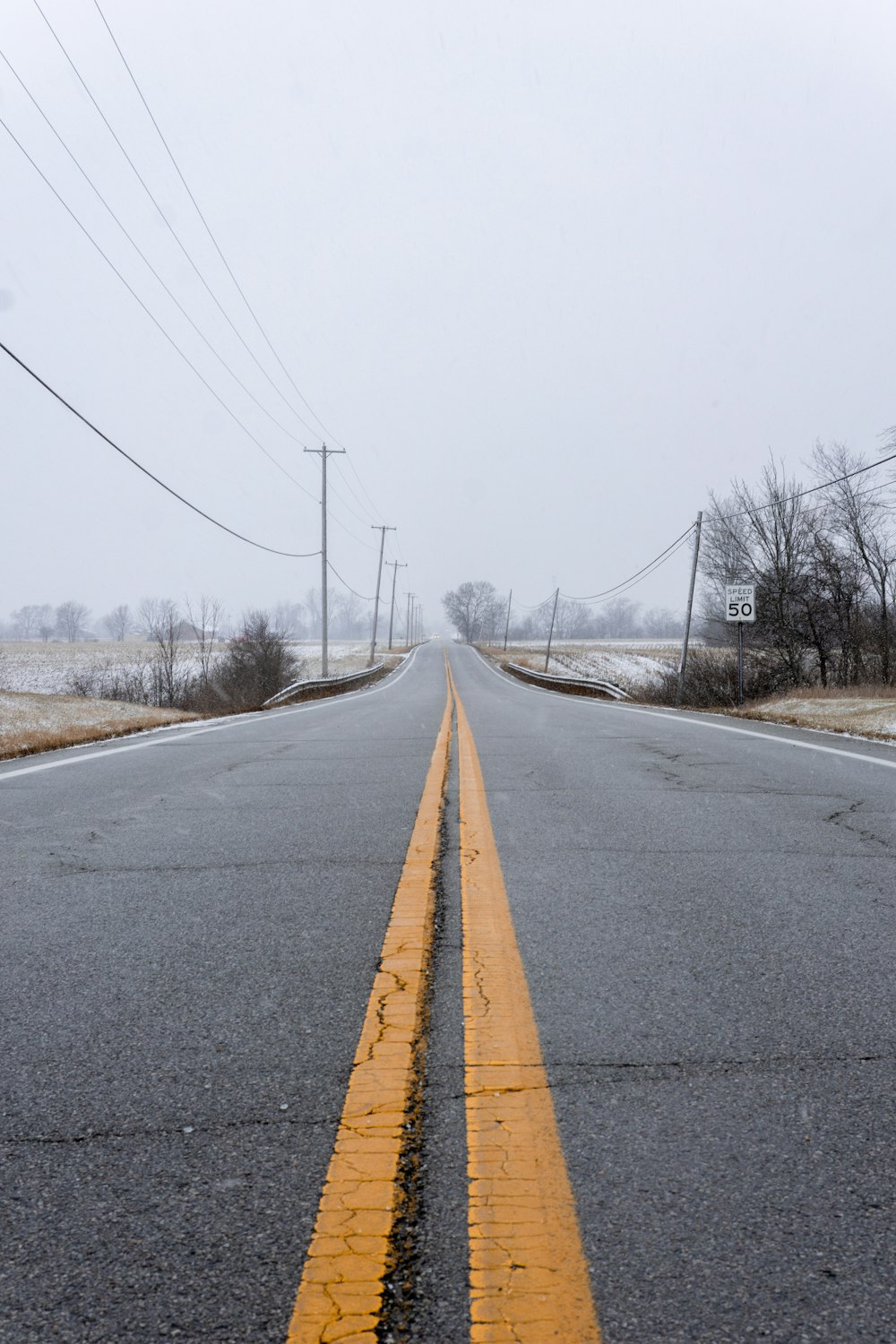 a road with a yellow line on the side of it