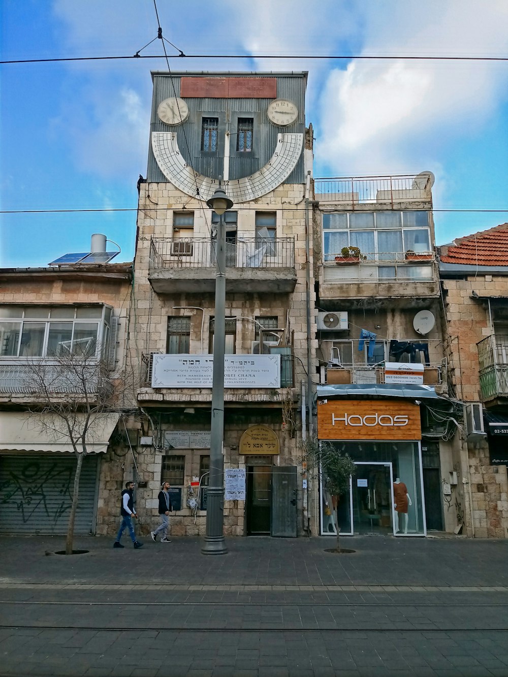 a tall building with a clock on the side of it