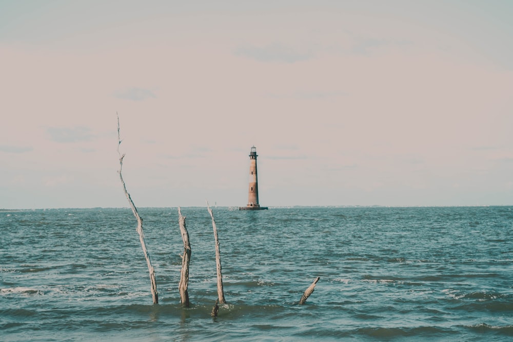 a light house in the middle of the ocean