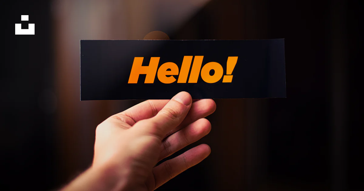 A person holding up a sign that says hello photo – Free Background ...