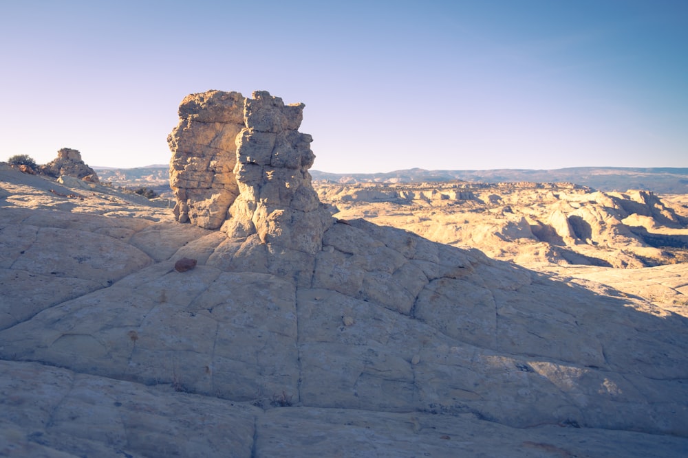 a rock formation in the middle of a desert