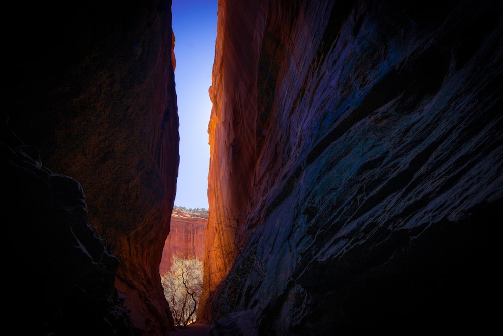 a narrow passage between two large rocks in a canyon