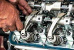 a close up of a person working on a machine