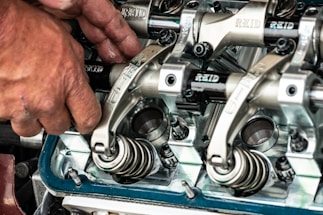 a close up of a person working on a machine